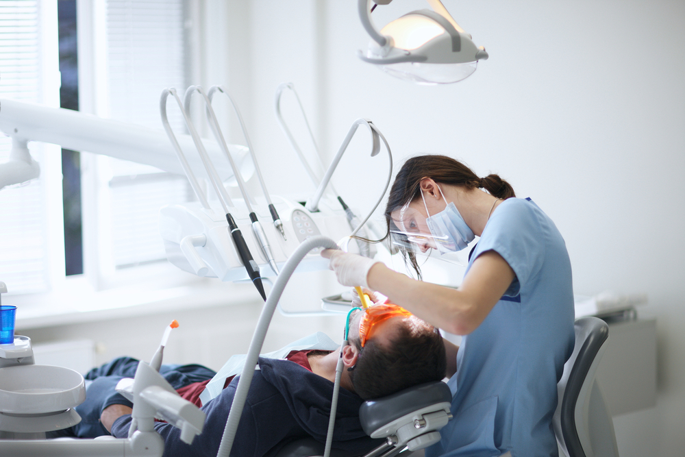 dental assistant working in a dental office