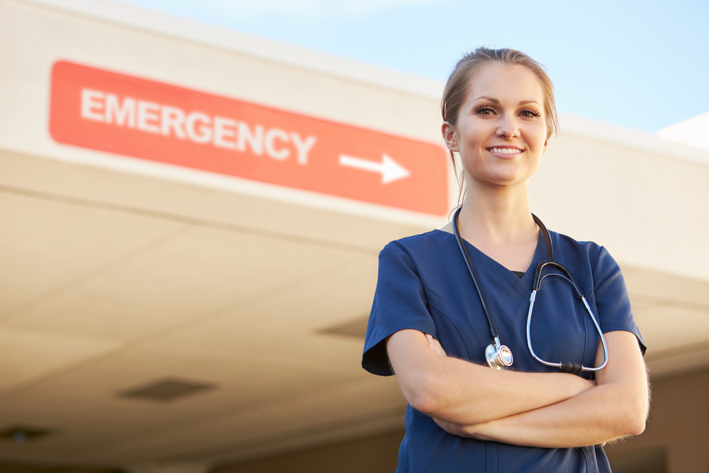 nurse in front of an emergency room 