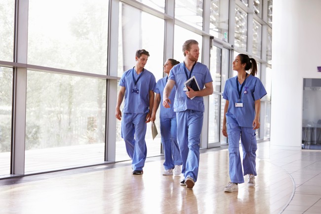 nurses walking down a hallway